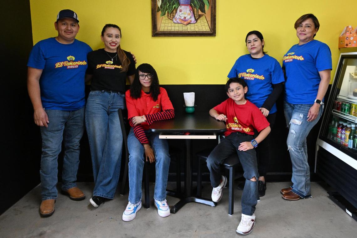 Members of the Reyes family pose for a portrait inside of their snack shop, El Tamarindo Snacks, on Friday, May 16, 2025, in Macon, Georgia. El Tamarindo Snacks opened in April and offers a variety of Mexican snacks, desserts and beverages.
