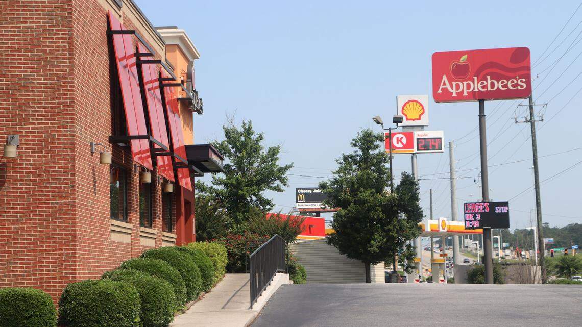 An armed robbery suspect was shot dead late Saturday after a Bibb County deputy confronted him in the parking lot of Applebee's on Riverside Drive following a reported armed robbery at the Circle K next door.
