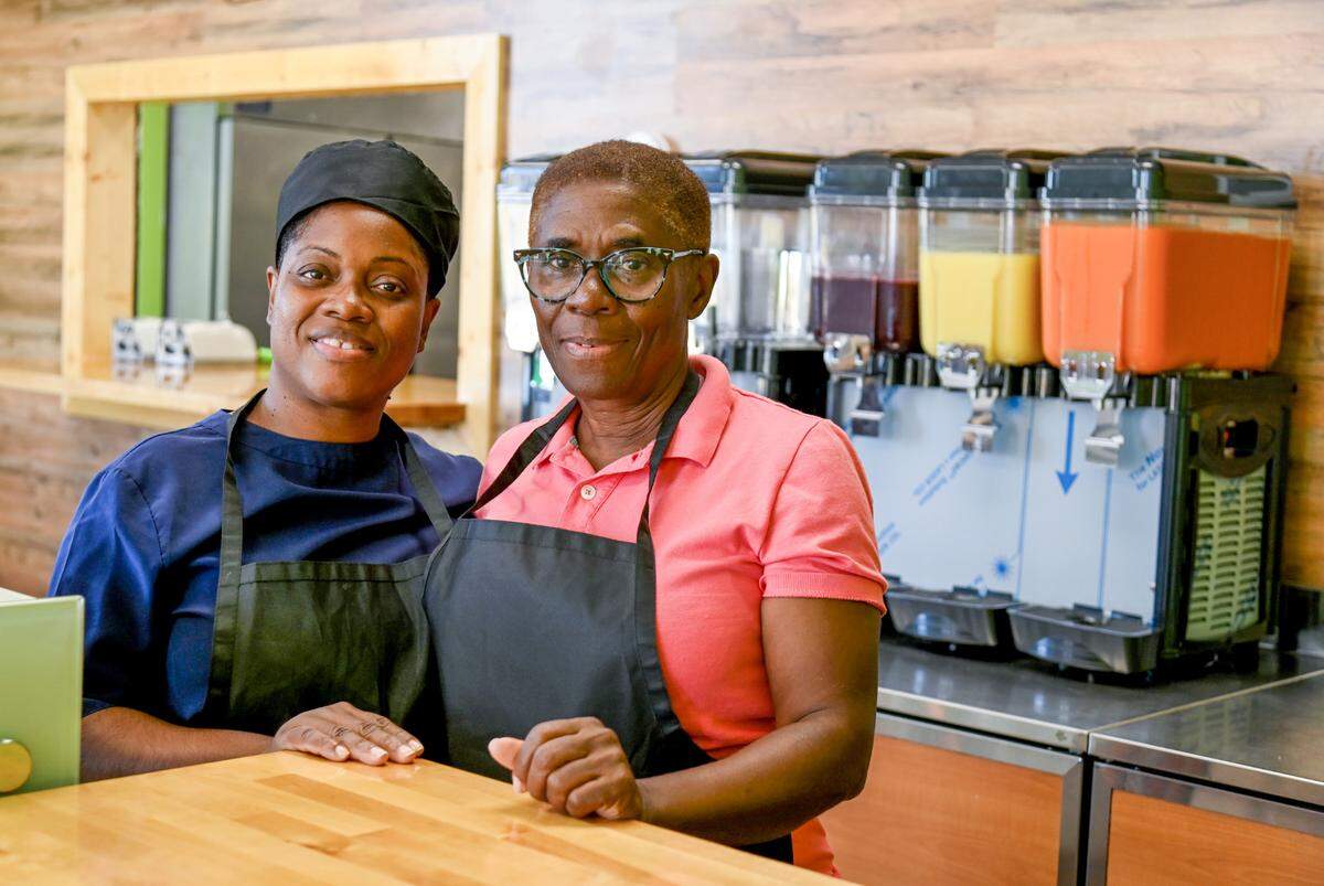 Owner Shanoy Miller, left and her mother Cleopatra James at Roots Plant Based Cafe at 100 Hamilton Pointe Drive, Suite 155, in Byron.