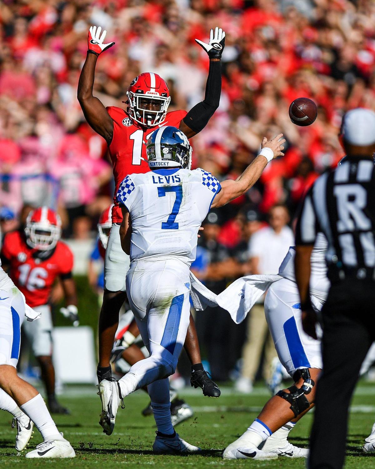 DONN RODENROTH,Athens, Georgia, 10/16/2021: Georgia defensive back Derion Kendrick pressures Kentucky quaterback Will Levis in action Saturday in Athens.