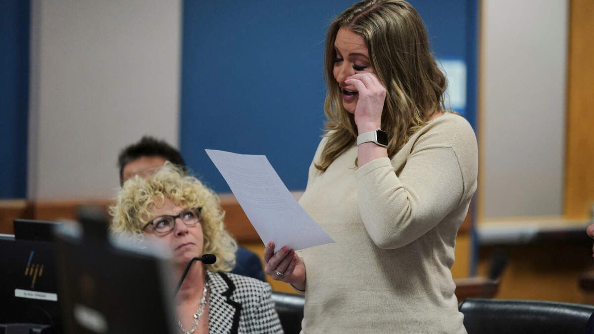 Former Trump campaign lawyer Jenna Ellis wipes away tears while reading a statement after pleading guilty Tuesday, Oct. 24, 2023 in the Georgia election subversion case. She has agreed to cooperate with Fulton County prosecutors. 