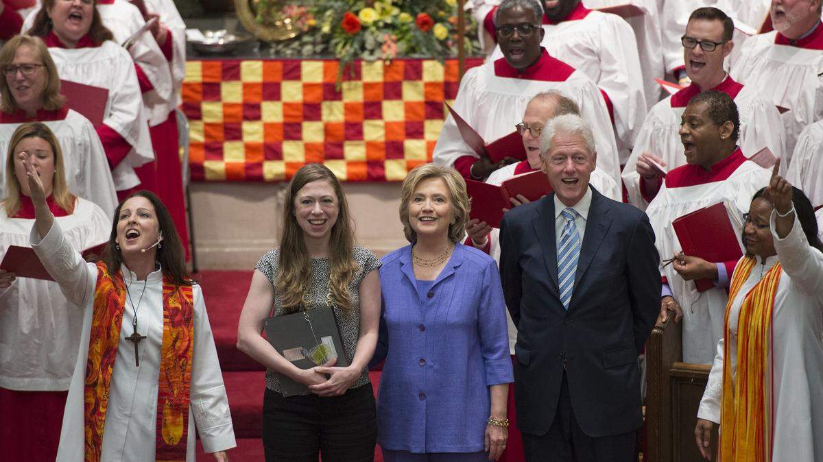 MOLLY RILEY/ASSOCIATED PRESSDemocratic presidential candidate Hillary Rodham Clinton, her daughter Chelsea, second from left, and husband, former President Bill Clinton, attend the Foundry United Methodist Church for its Bicentennial Homecoming Celebration on Sunday in Washington, D.C. During President Bill Clinton’s presidency, the Clintons worshipped and participated regularly at Foundry. Also pictured in front of the choir are the Rev. Ginger Gaines-Cirelli.