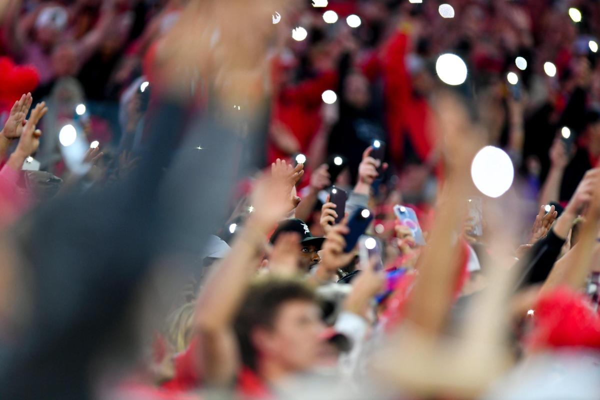 Georgia fans light of the stadium at the start of the 4th quarter Saturday in Jacksonville as the Dawgs beat Florida 42-20.