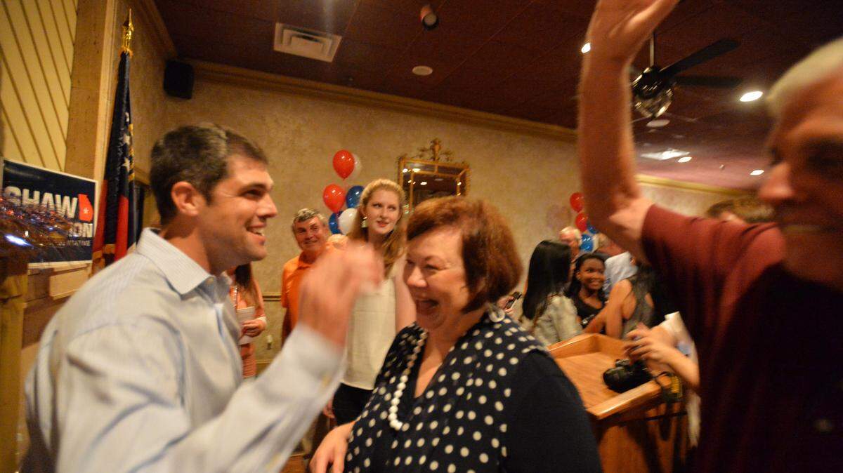 BEAU CABELL/THE TELEGRAPH 
 Perry, Ga., 08/1 1/2015: Georgia House District 146 winner Shaw Blackmon, left, gets congratulations from supporters Tuesday after beating Larry Walker III in a run off.