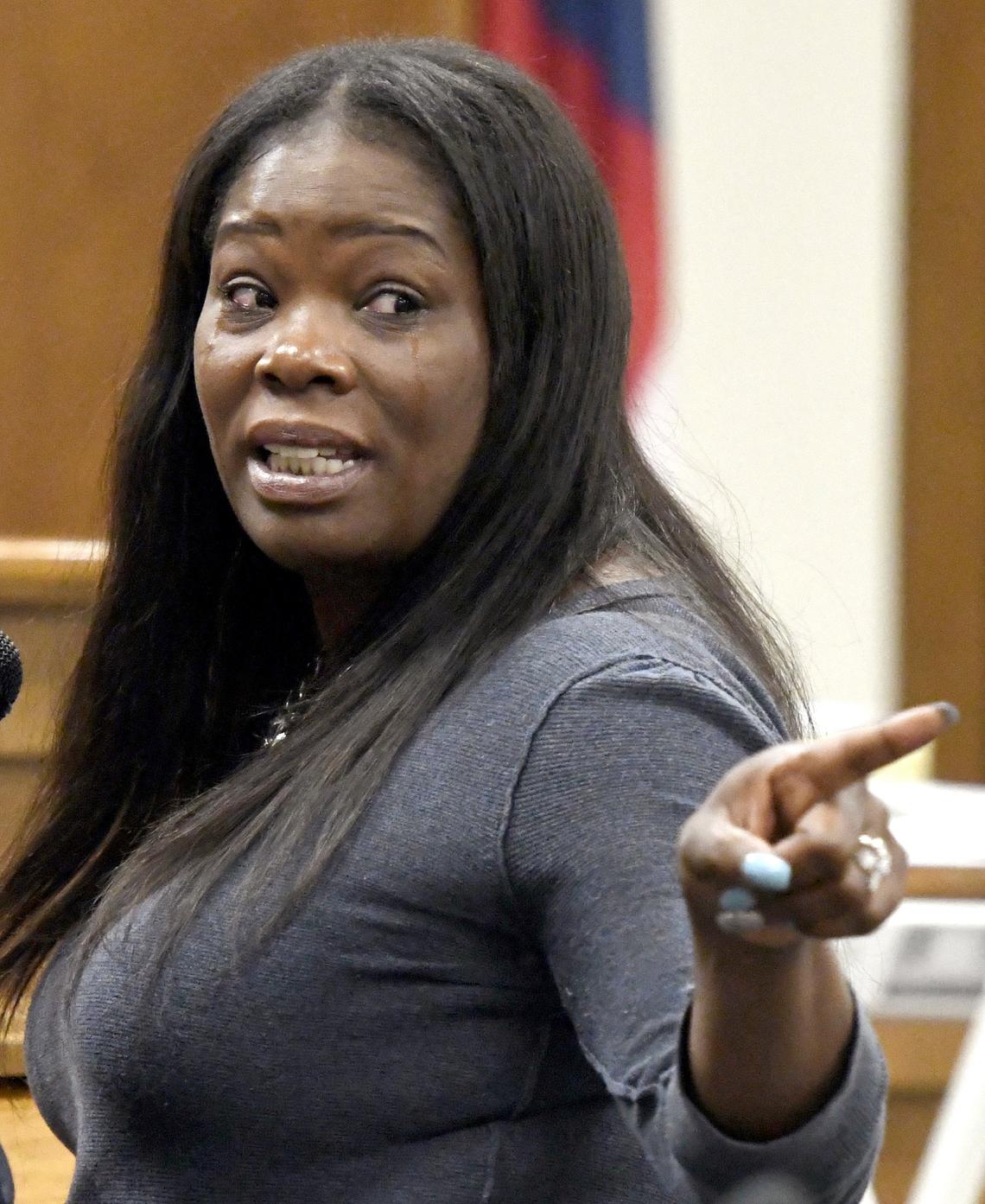 With tears in her eyes Bridgite Marcus points to her son Vernon Marcus Jr. during the sentencing hearing for Elisabeth Faye Cannon Wednesday afternoon in Bibb County Superior Court. Cannon was sentenced to 20 years in prison with five on probation after her guilty plea for aggravated assault after shooting Marcus' son Marcus Jr. in the head Jan. 6, 2017.