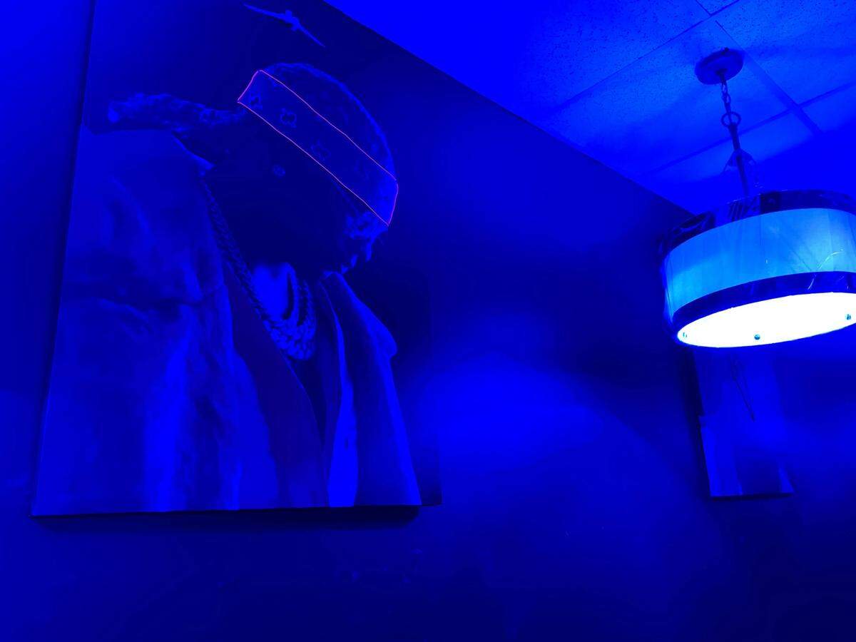 Photos of Hip Hop artists hang on the walls of Purge Lounge 25 at 115 Margie Drive, Suite A, in Warner Robins.