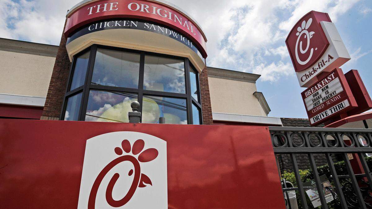 FILE - This July 19, 2012, file photo shows a Chick-fil-A fast food restaurant in Atlanta. Chick-fil-A is ending donations to three groups that oppose gay marriage in an effort to halt protests and broaden its customer base. But the move has angered some of the fast food chain’s fans. The Atlanta-based company said Monday, Nov. 18, 2019, that starting next year, it will focus its giving on three areas: hunger, homelessness and education. (AP Photo/Mike Stewart, File)