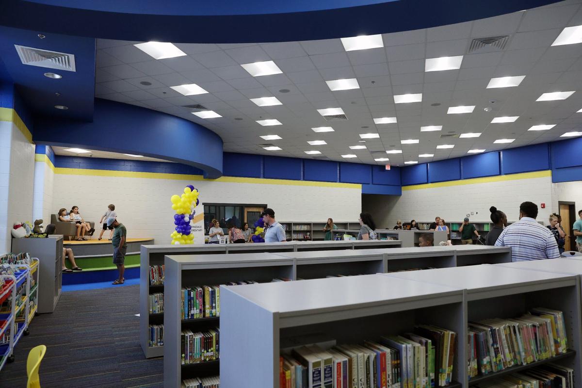 Springdale Elementary School students and families explore the brand new library during open house on Friday, Aug. 2, 2024, in Macon, Georgia. The original Springdale Elementary opened 53 years ago, but this brand new building completed this summer will be ready for the new school year starting Aug. 5.