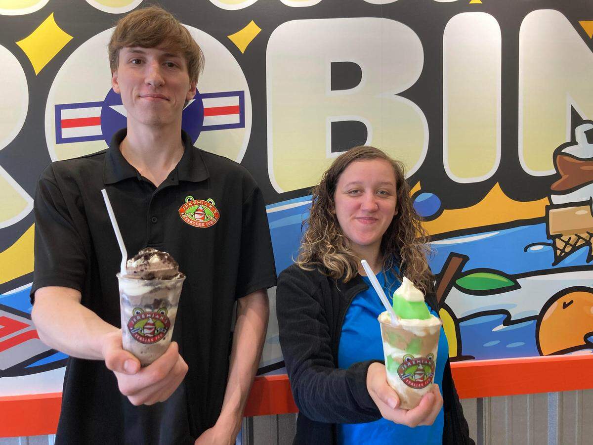 Grant Ledford and Zoe Gennaria of Jeremiah’s Italian Ice serve up an Oreo mud pie gelati and a caramel apple gelati. Gennaria is the manager of the new Warner Robins location, the first in Middle Georgia, opening Tuesday.