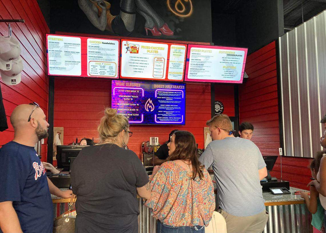 People line up to place an order at a pre-opening event at The Hot Chik in Warner Robins.