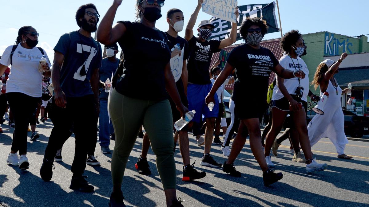 JENNA EASON/THE TELEGRAPH Macon, GA, 06/13/2020: People march down Watson Boulevard in Warner Robins at a “Unity in Community Protest” march held by the Houston County chapter of the NAACP on Saturday.