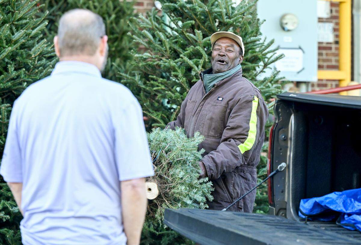 Larry Stephens has been working for Slaughter’s Christmas Trees at the Macon State Farmers Market since 1980.
