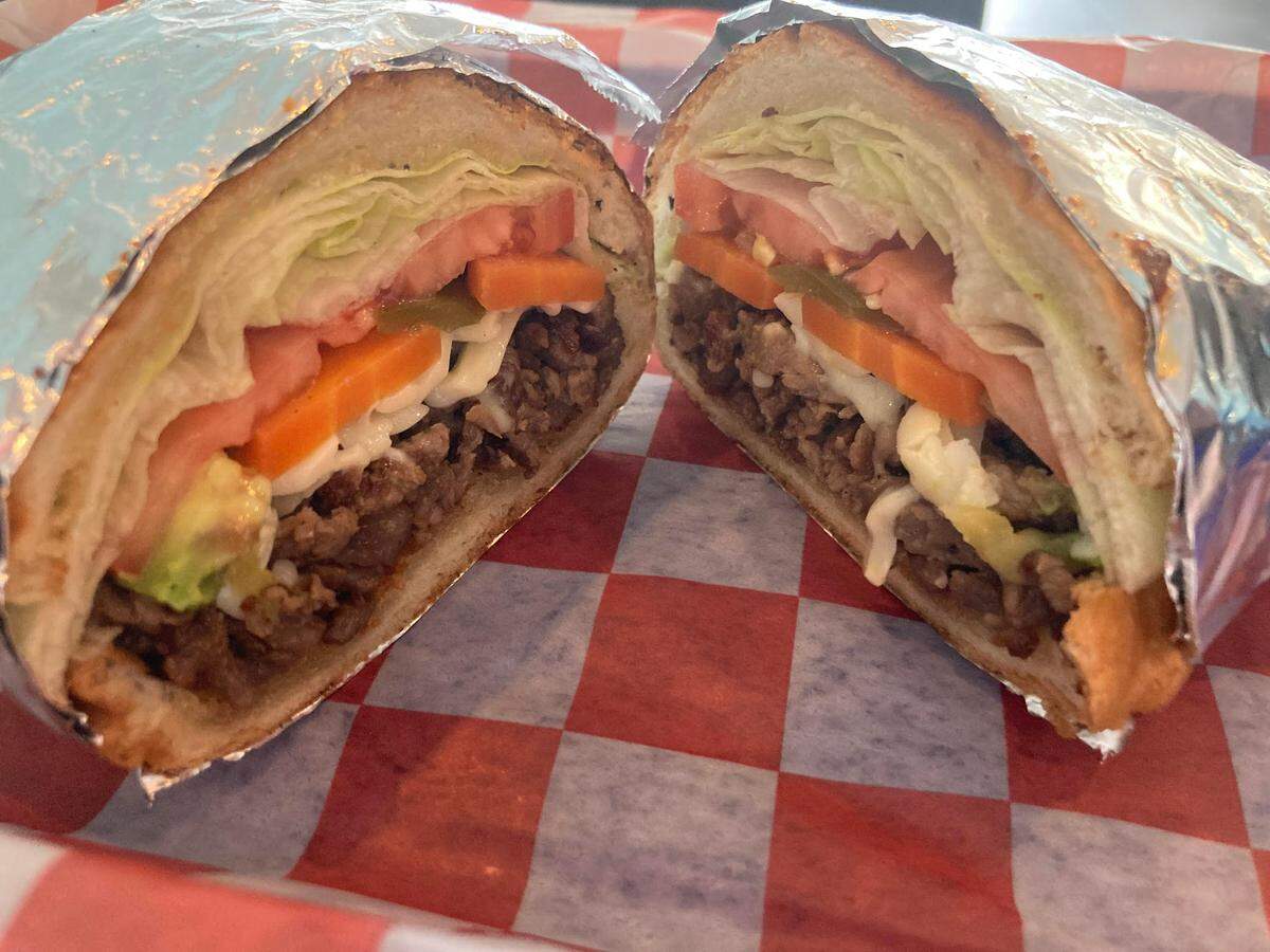 An asada torta, a Mexican grilled steak sandwich with lettuce, tomato, jalapeno and avocado from Taqueria Don Sammy at 1754 Watson Blvd. in Warner Robins.
