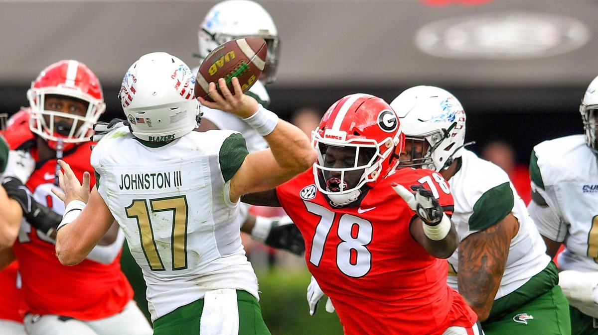 Georgia Bulldog defender Nazir Stackhouse pressures UAB quarterback Tyler Johnston III in first half action.