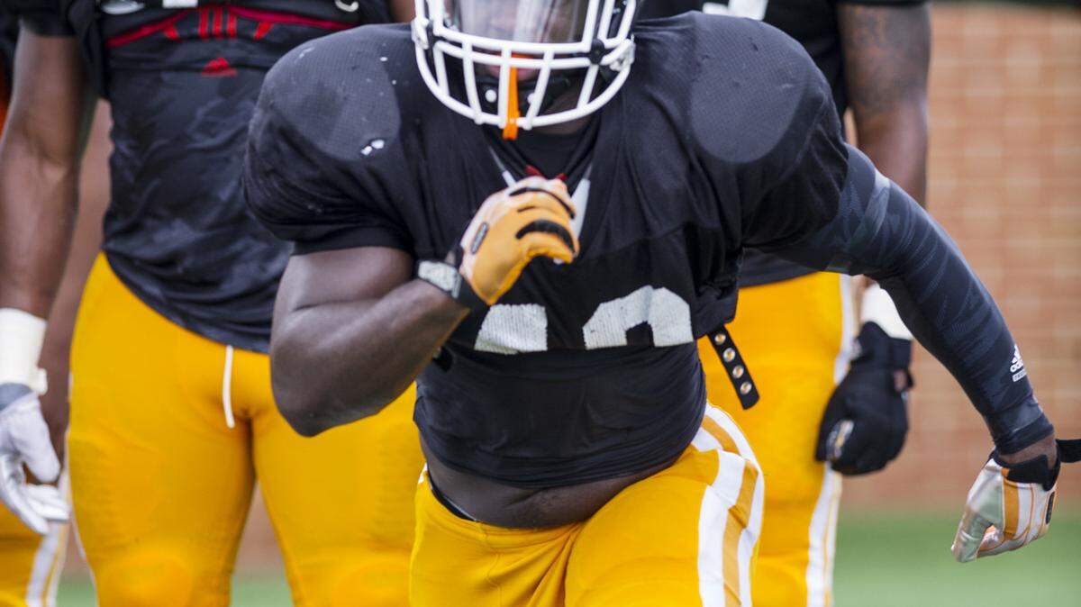 Mercer linebacker Lee Bennett (40) runs a drill at practice Wednesday morning.