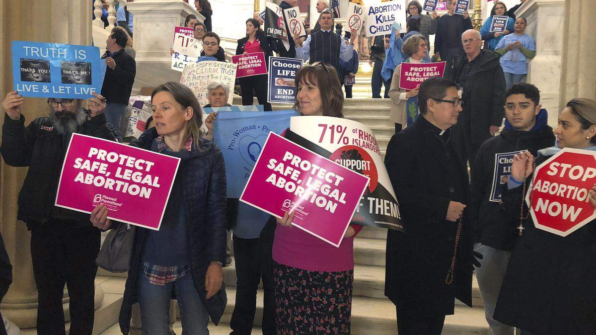 People both supporting and opposing abortion protest at the Statehouse March 5 in Providence, R.I.