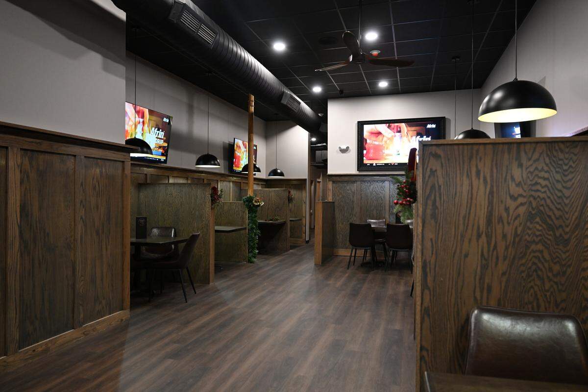 New tables sit in the downstairs of Bearfoot Tavern after reopening on Tuesday, Dec. 9, 2025, in downtown Macon, Georgia. The restaurant is still waiting on booths to finish the downstairs renovation. 