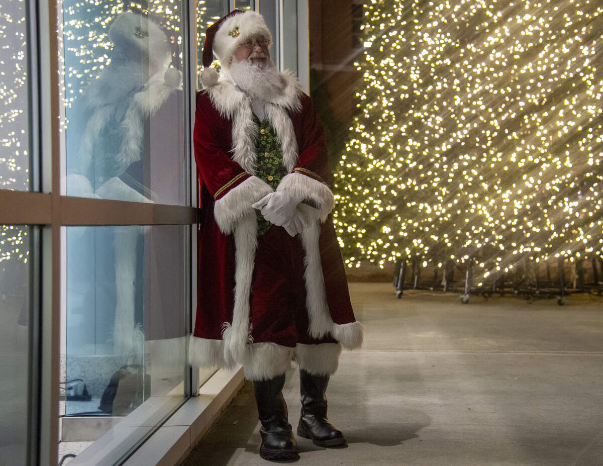 Santa Claus relaxes against a window the night of Dec. 3 at Beverly Knight Olson Children’s Hospital, Navicent Health after a “A Night of Lights” Christmas tree lighting.