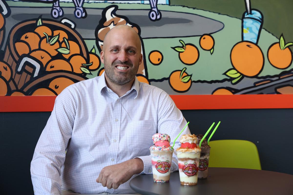 Jason Carroll poses with three Jelati inside of Jeremiah’s Italian Ice on Wednesday, Nov. 20, 2024, in Centreville, Georgia. Carroll plans to open Middle Georgia’s fourth Jeremiah’s Italian Ice location in Macon in March 2025.