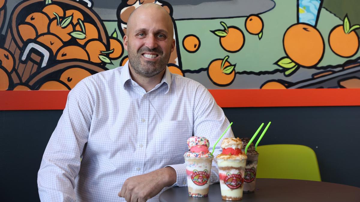 Jason Carroll poses with three Jelati inside of Jeremiah’s Italian Ice on Wednesday, Nov. 20, 2024, in Centreville, Georgia. Carroll plans to open Middle Georgia’s fourth Jeremiah’s Italian Ice location in Macon in March 2025.