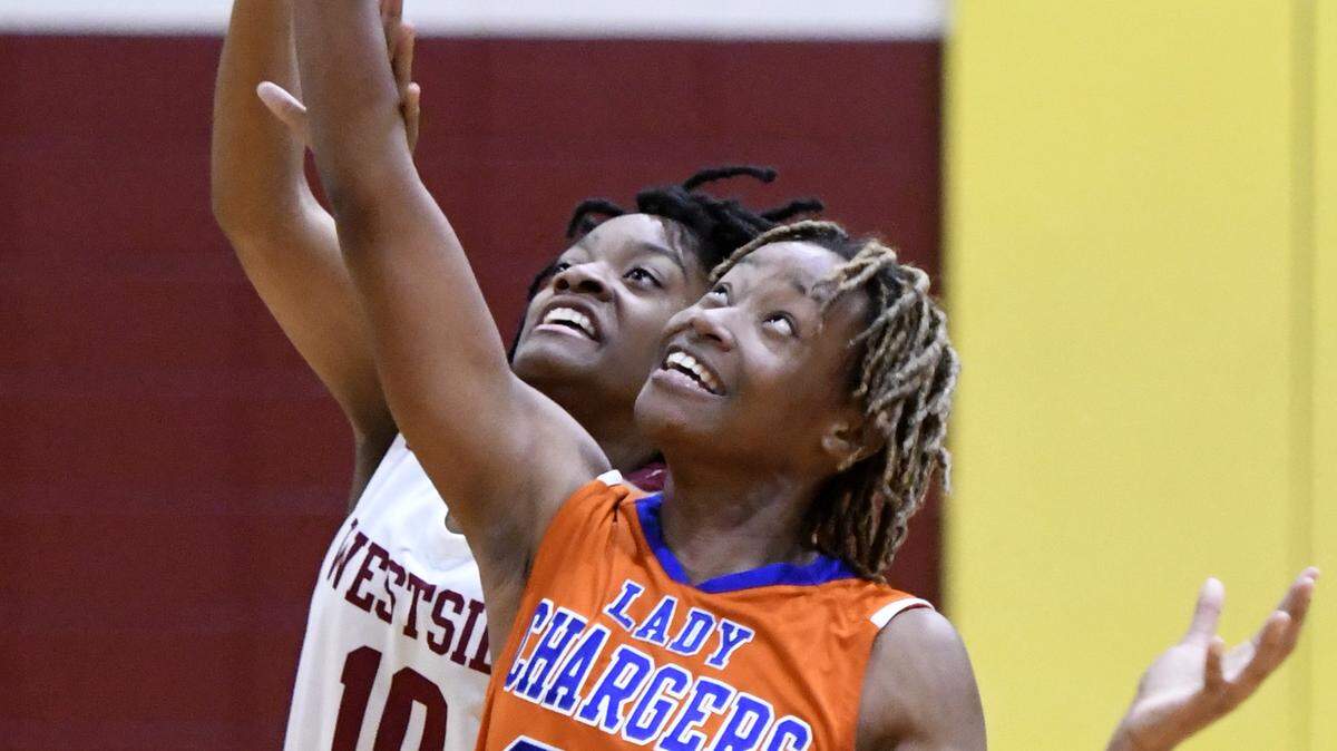 Central’s Brooklynn Talton (23) battles for a loose ball with Westside’s Zyndia Robinson (10) during their game January 15.
