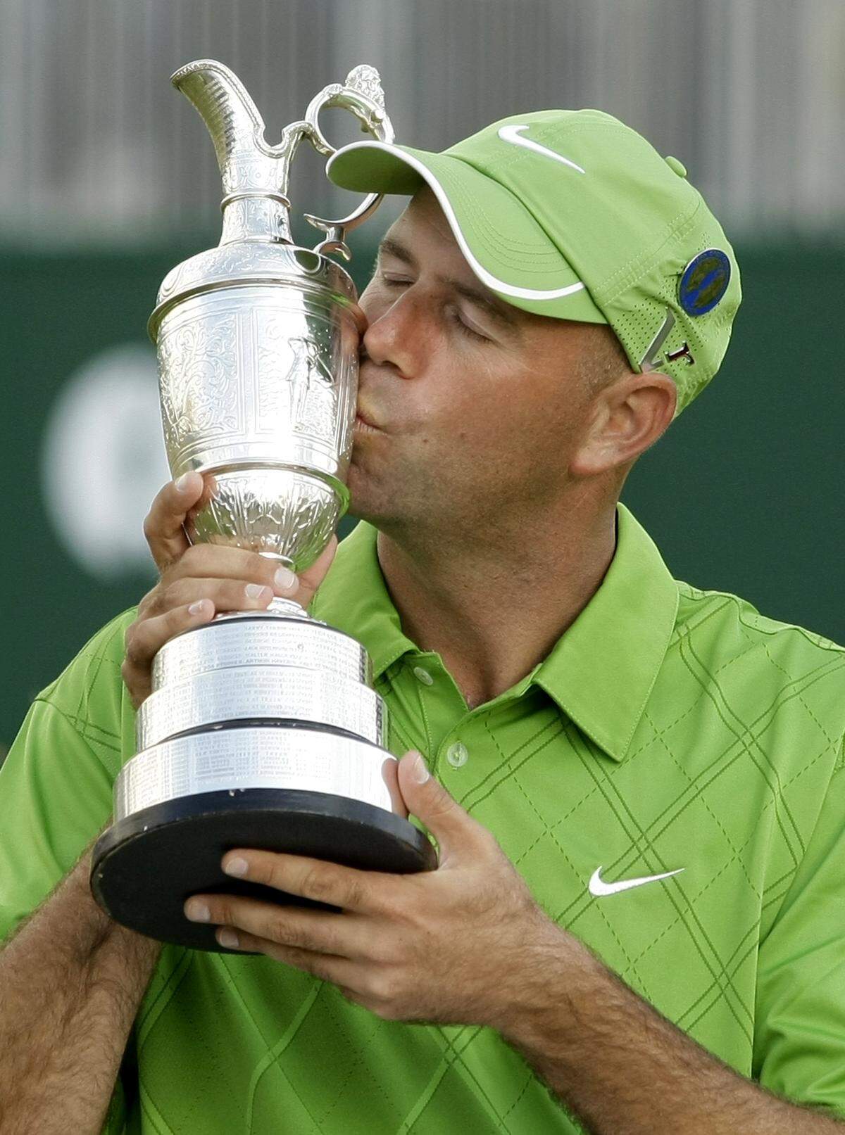 Stewart Cink of the US kisses the trophy after winning a playoff following the final round of the British Open Golf championship, at the Turnberry golf course, Scotland, Sunday, July 19, 2009. (AP Photo/Matt Dunham)