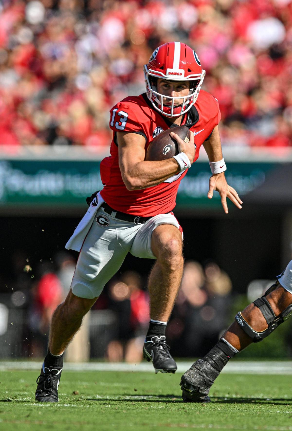 Georgia quarterback Stetson Bennett scrambles for a first down in action Saturday against Vanderbilt.