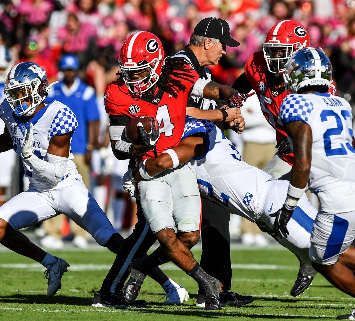 DONN RODENROTH,Athens, Georgia, 10/16/2021: Georgia running back James Cook picks a few yards in action Saturday against Kentucky.