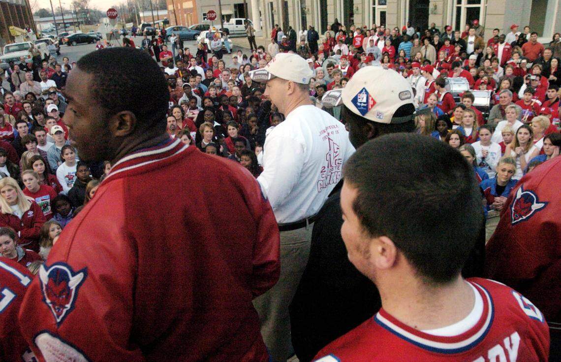 In this 2003 Telegraph file photo, head coach Lee Campbell speaks to the large crowd assembled on Lumpkin Street in Hawkinsville to celebrate the Red Devils 2003 15-0 Class A State football championship.