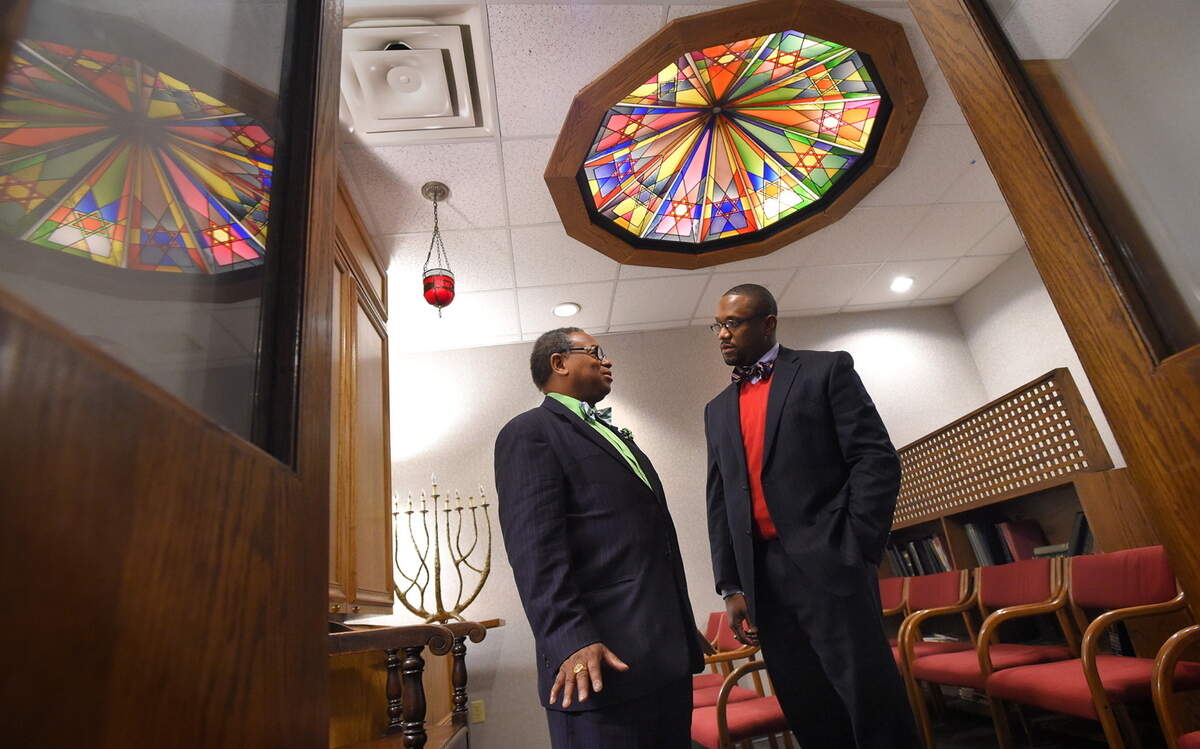 The Rev. Cleveland Mason, left, a pastor at Perkins Square Baptist Church, and the Rev. Domanic Smith, pastoral outreach coordinator at Sinai Hospital, talk in the Baltimore hospital's chapel.