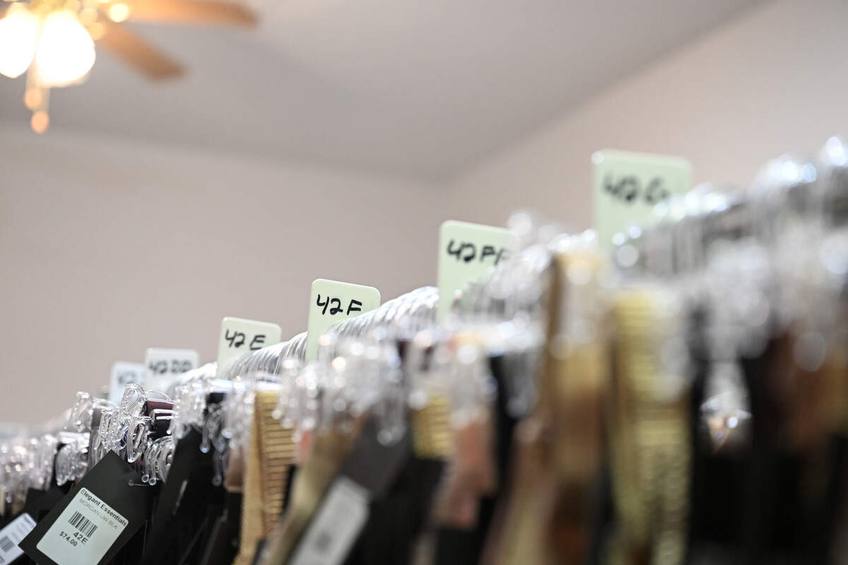 Owner Beth Strickland organizes inventory by size in the backroom of Elegant Essentials in Warner Robins, Ga. Strickland’s bra salon carries band sizes 30-46 and cup sizes A-KK.