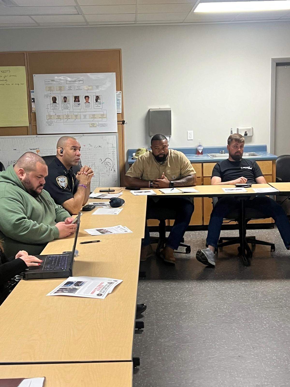 Campus Police Chief Curtis Adams (second to left) and other campus police sat down with the Bibb County Sheriff’s Office to discuss how to prevent crime in the community.