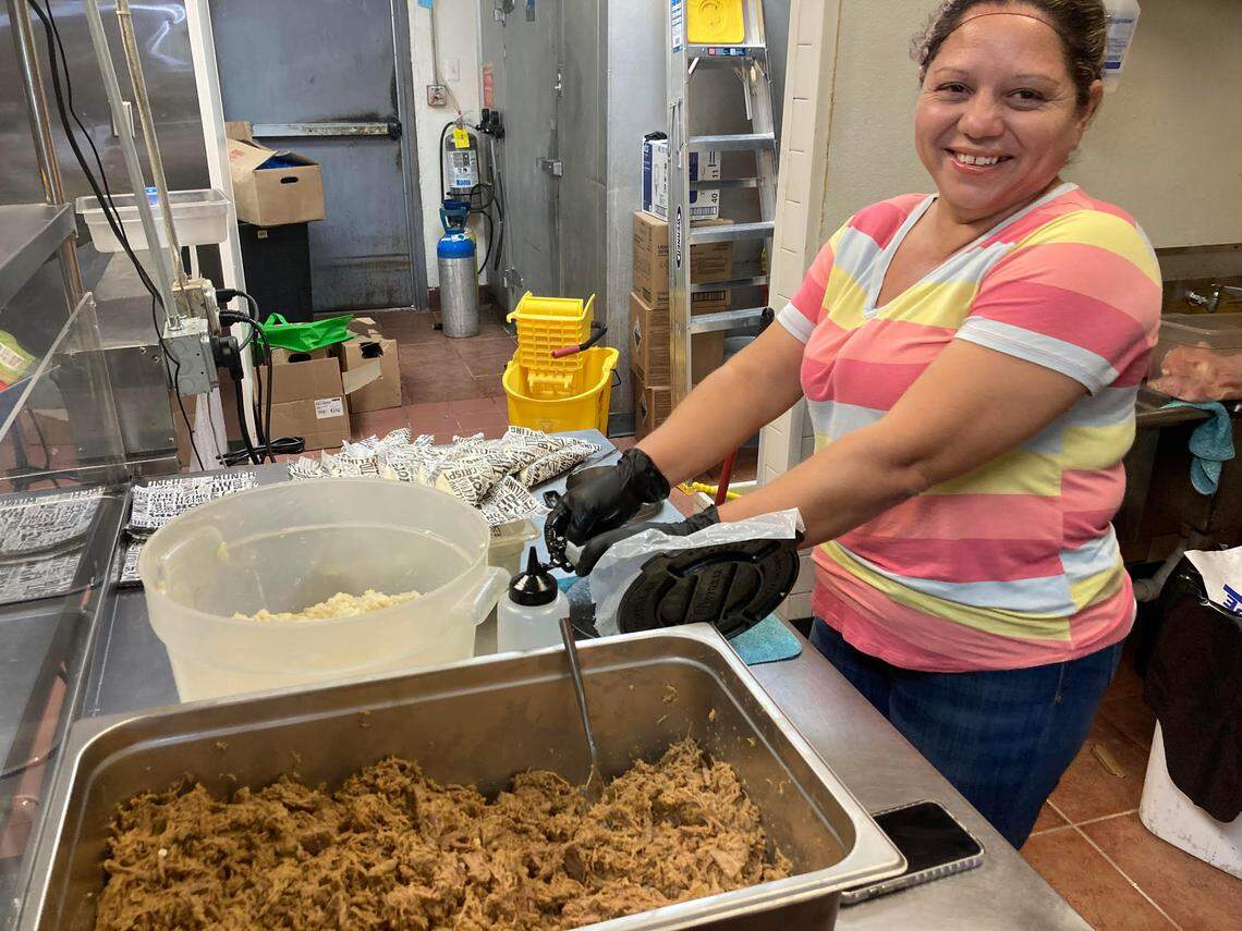 Yaselys Cordero of Venezuela looks up while making empanadas ready for frying at Sabor Latino Venezuelan Restaurant, a new spot in Warner Robins.