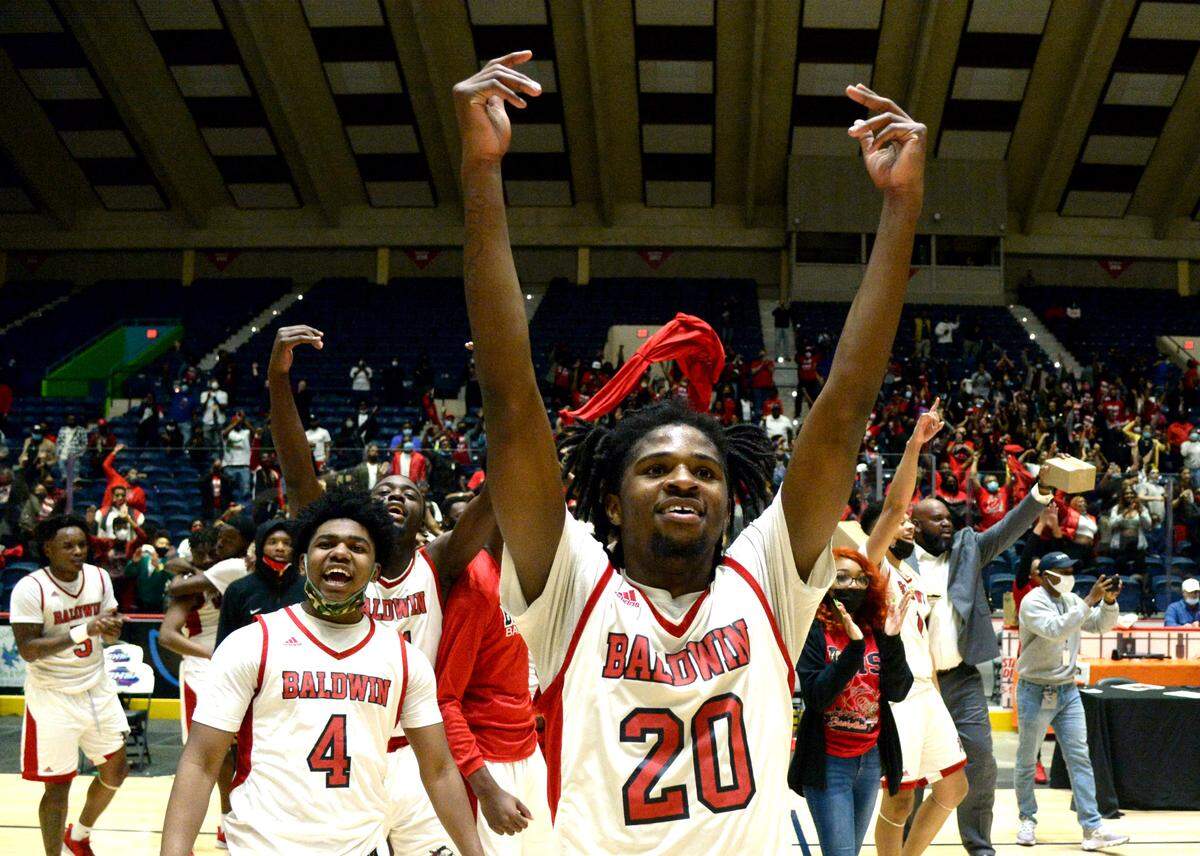 Baldwin players celebrate their 54-53 last second over Fayette County during the GHSA 4A State Championship game Wednesday night in Macon.