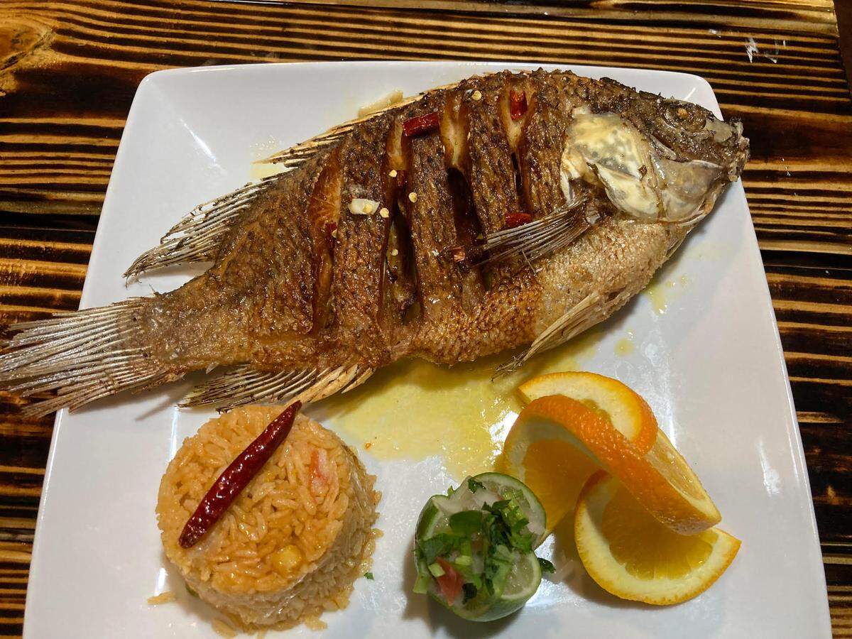 Among the specialties at this new authentic Mexican restaurant is Warner Robins is mojarra, a whole fried fish with a special garlic sauce and served with lettuce, sliced avocado, red onion, tomatoes and cucumber.