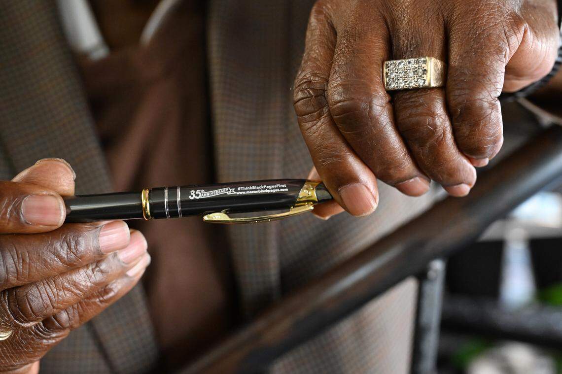 Macon-Middle Georgia Black Pages founder and publisher Alex Habersham holds a 35th anniversary commemorative pen in his office on Tuesday, Feb. 24, 2026, in Macon, Georgia. The Black Pages began in 1991 and have continued as a guide for highlighting local Black owned businesses.
