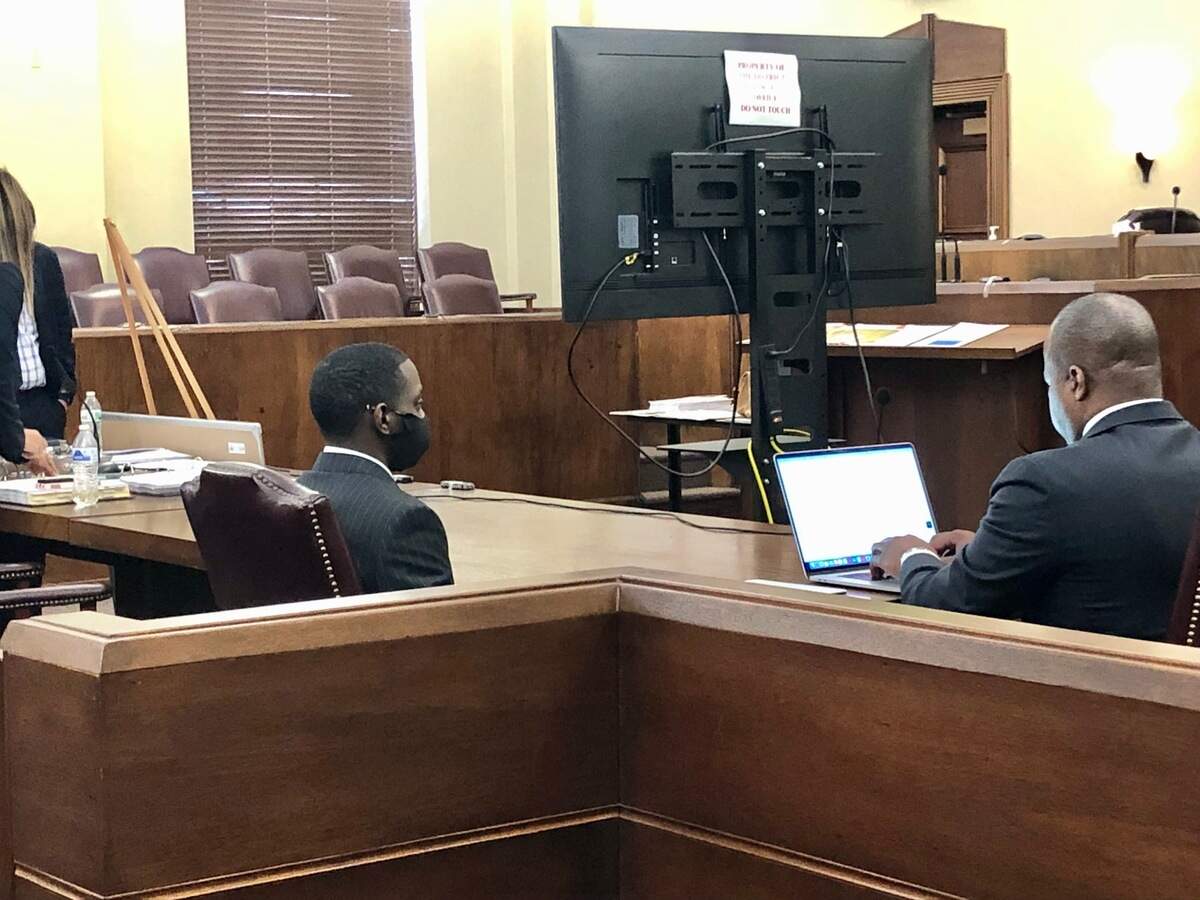 Demarcus Little, left, seated in Peach County Superior Court during a break this week in his murder trial in the February 2020 death of Fort Valley State University student Anitra Gunn.