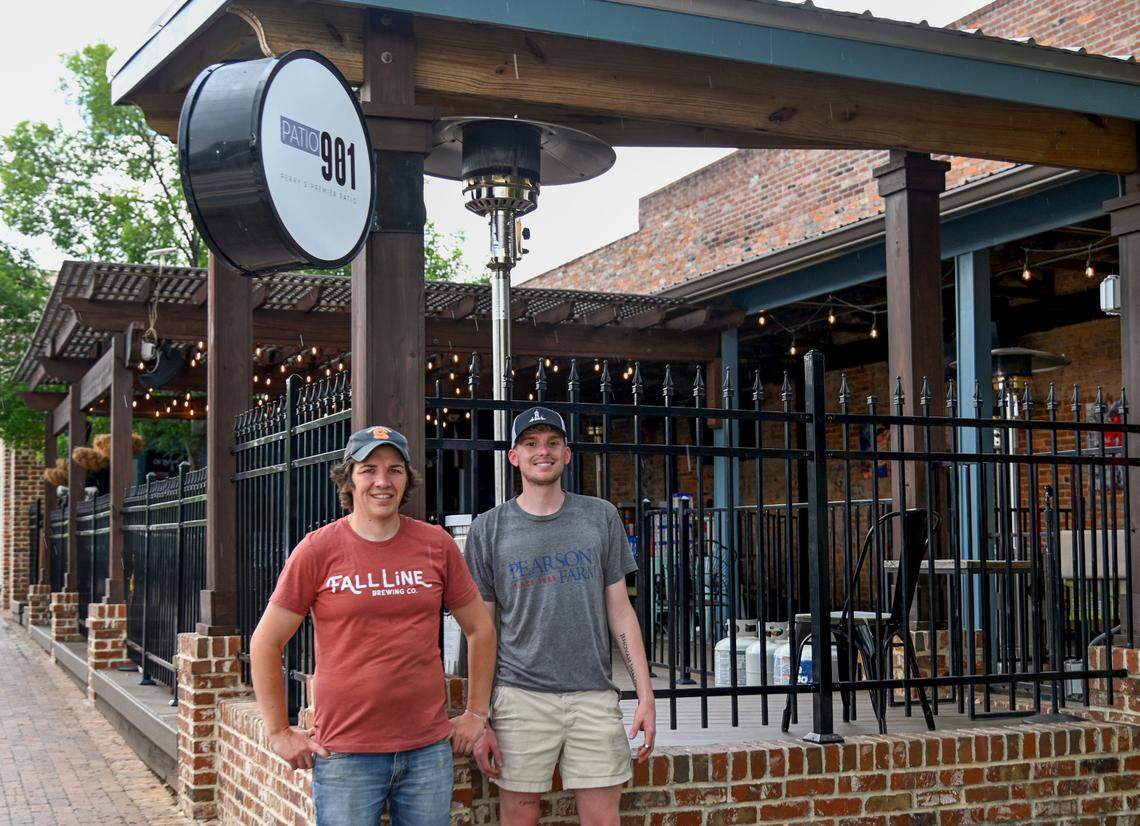 From left, Patio 901 owners Eric Schultz and Charlie Shimp. The business partners have rebranded their popular outdoor venue previously known as Hazard’s on the Green at 901 Carroll St. in downtown Perry.