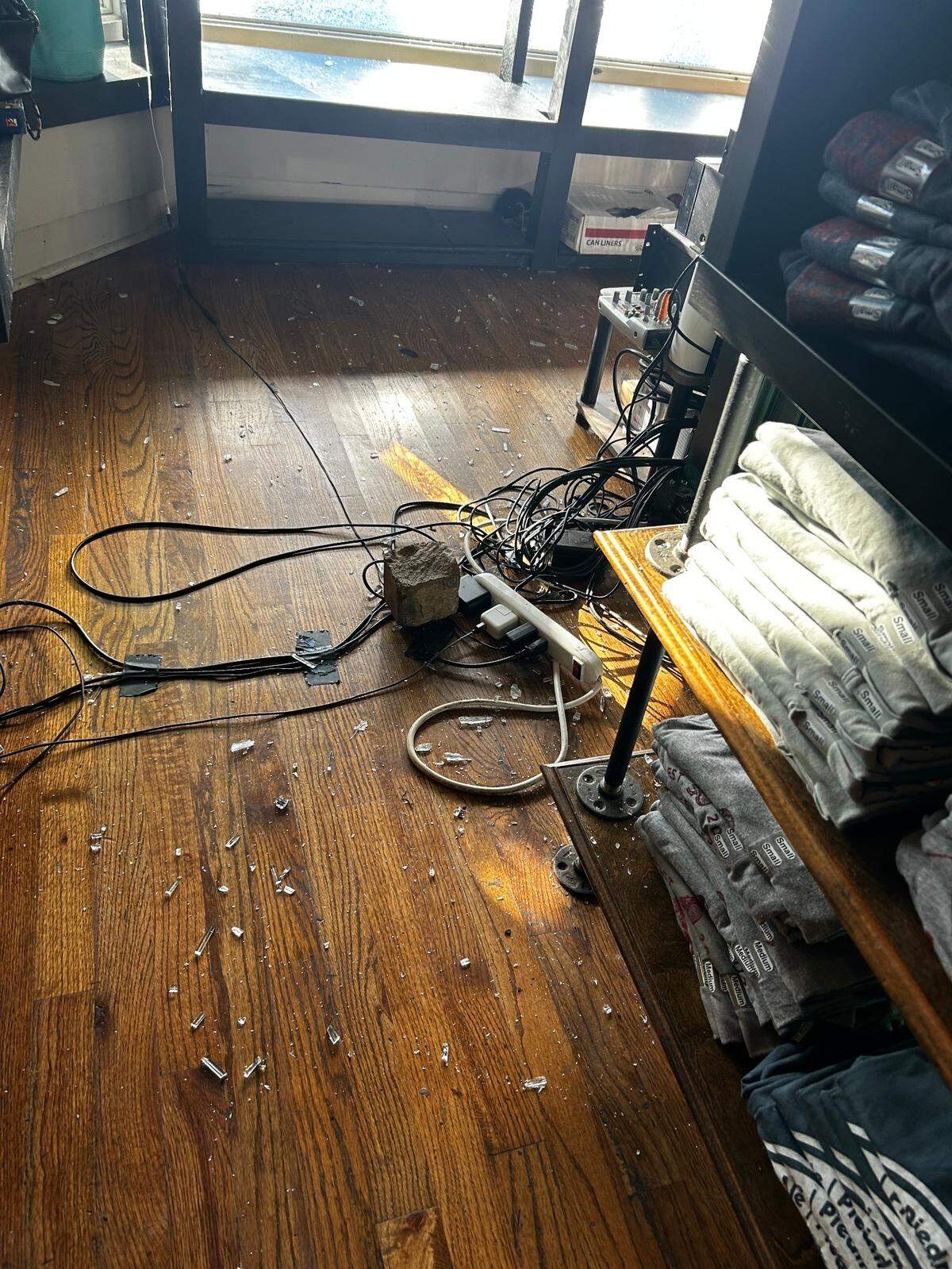 Glass shattered across the floor behind the host stand of Piedmont Brewery and Kitchen when a brick was thrown through the window July 11, 2024.