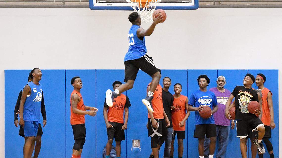 Fellow all-stars watch a 360 dunk attempt by Taylor County's Lyn-J Dixon (23) during the Middle Georgia All-Star Basketball Classic in March at Tattnall Square Academy. Instead of focusing on the rim and player during a dunk contest in March I positioned myself at the other end of the court as fellow competitors were gathered under the basket. The body positioning of Dixon and the faces of the other competitors is why I enjoy this image.