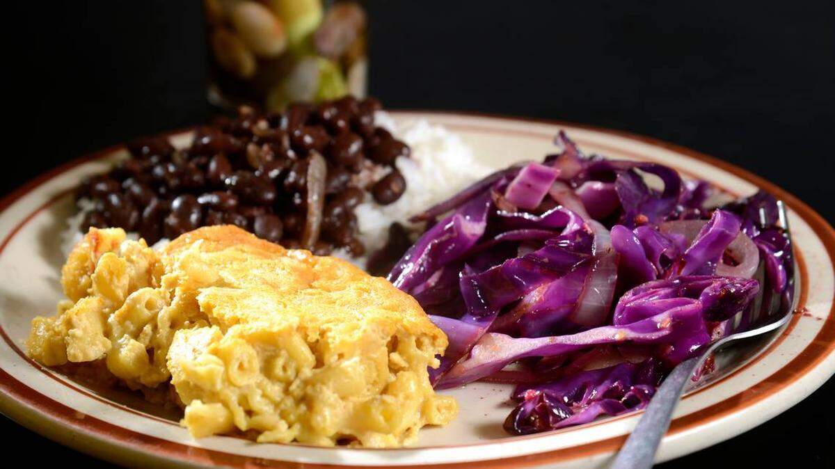 Archive photo of vegan macaroni and cheese, spicy red cabbage and black beans with coconut rice at Back to Edenz,  for a restaurant review in 2014.