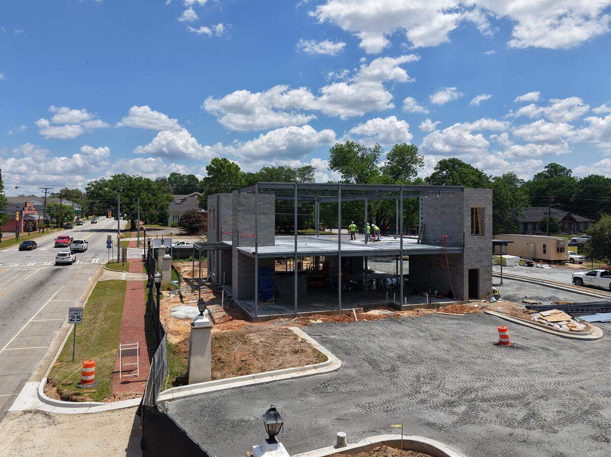 Construction of Morris Bank, a division of Vallant Bank, on the former New Perry Hotel site off of Main Street on Tuesday, May 5, 2026, in Perry, Georgia. The entrance columns to the former New Perry Hotel have been preserved on site.