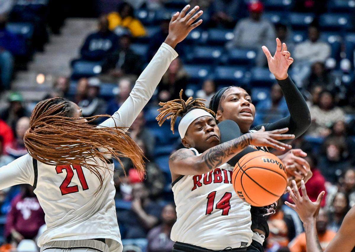 Warner Robins’ Chelsea Thomas (14) battles for a rebound during the Demonettes’ GHSA 5A State Championship game against Kell Thursday night in Macon.