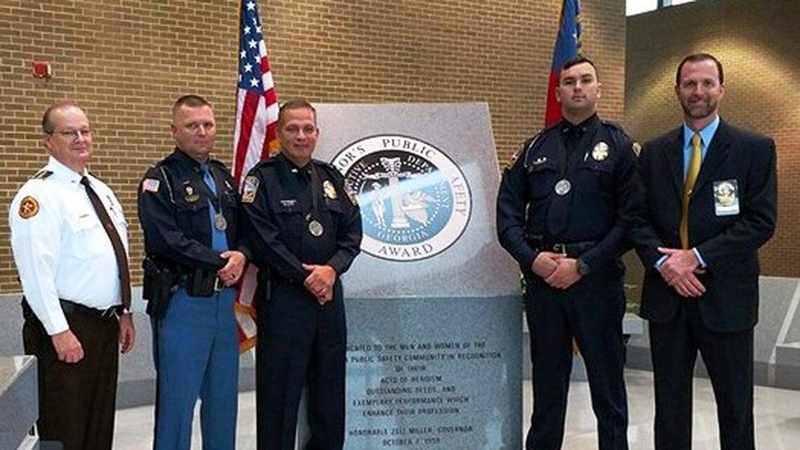 From left to right, Peach County Sheriff Terry Deese, former Byron police Sgt. Eric Farris, who is now with the Houston County Sheriff's Office, Byron police officers Michael Welch and Wesley Griffis and Byron Police Chief Wesley Cannon. Farris, Griffis and Welch are 2017 recipients of the Govenor's Public Safety Award for their response to the Nov. 6, 2016 fatal shooting of Peach County deputy Daryl Smallwood and Sgt. Patrick Sondron.