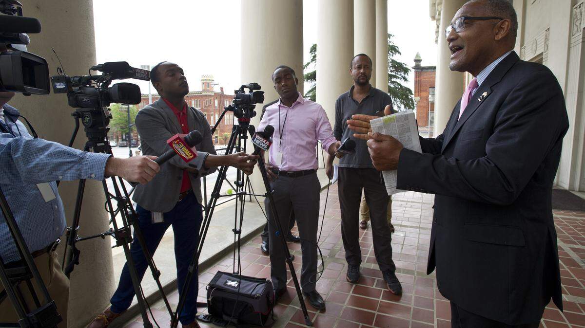 Tax commissioner candidate C. Jack Ellis talks to the media on March 31 at the Macon-Bibb County Government Center.