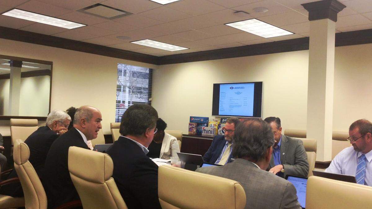 Ken Neil with Clifton, Lipford, Hardison & Parker, LLC, second from left, presents the 2017 audit to the Macon-Bibb County Industrial Authority on Dec. 20, 2017.