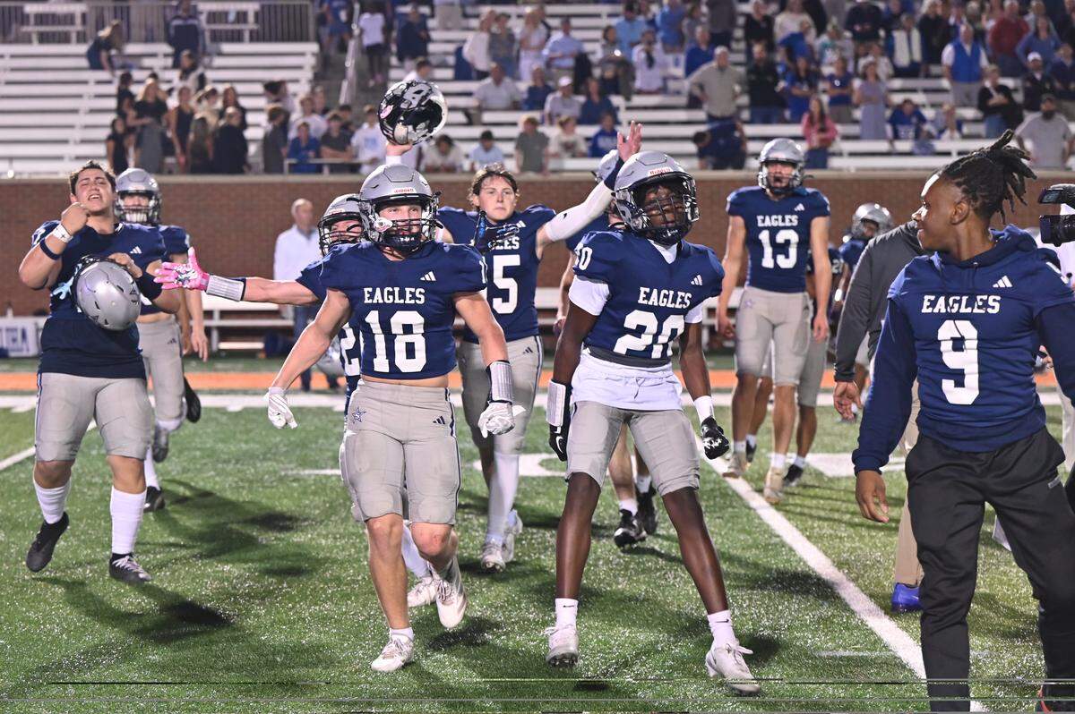 Stratford Academy football players celebrate after winning the GIAA 4A state championship on Saturday, Nov. 22, 2025, at Five Star Stadium in Macon, Georgia. The Stratford Academy Eagles beat the Brookstone School Cougars 14-7. 
