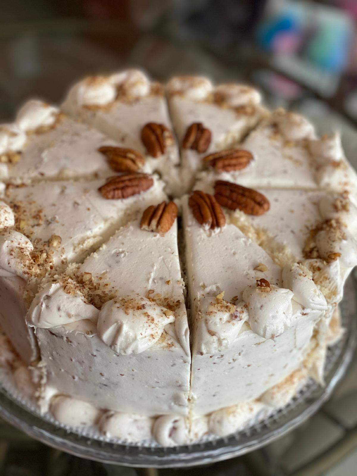 Butter Pecan Cake from Sweet Rain Vegan Bakeshop. “Our buttery butter pecan cake layers iced with our butter pecan icing and garnished with roasted pecan pieces.”