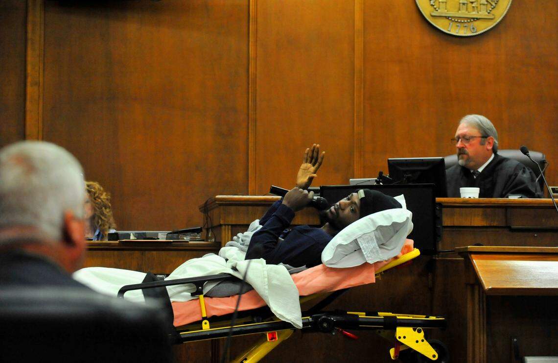 Darius Rozier, 27, sworn in before testifying from a gurney in Bibb County Superior Court on Wednesday.