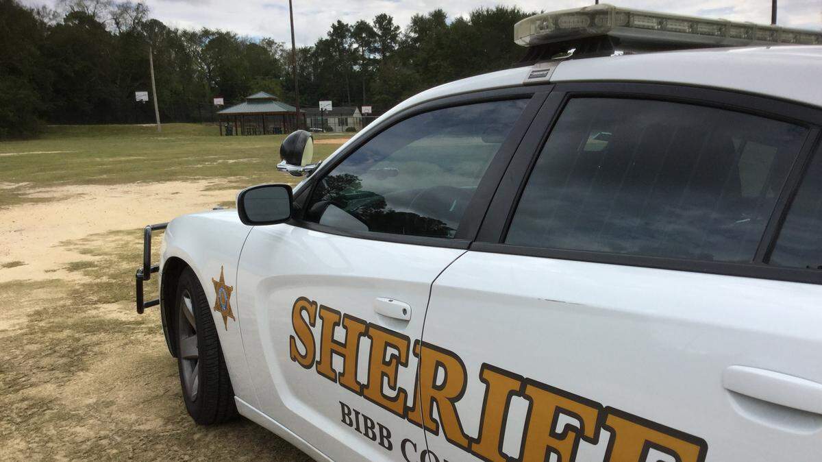 Bibb County sheriff’s deputies look for evidence after a teen was reportedly shot near the basketball court off Hillcrest Avenue Friday. They later learned the wound was self-inflicted.